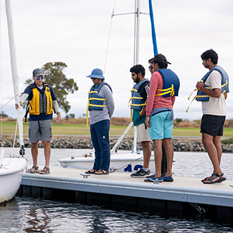 students receiving sailing instructions at shoreline lake. students receiving sailing instructions at shoreline lake.