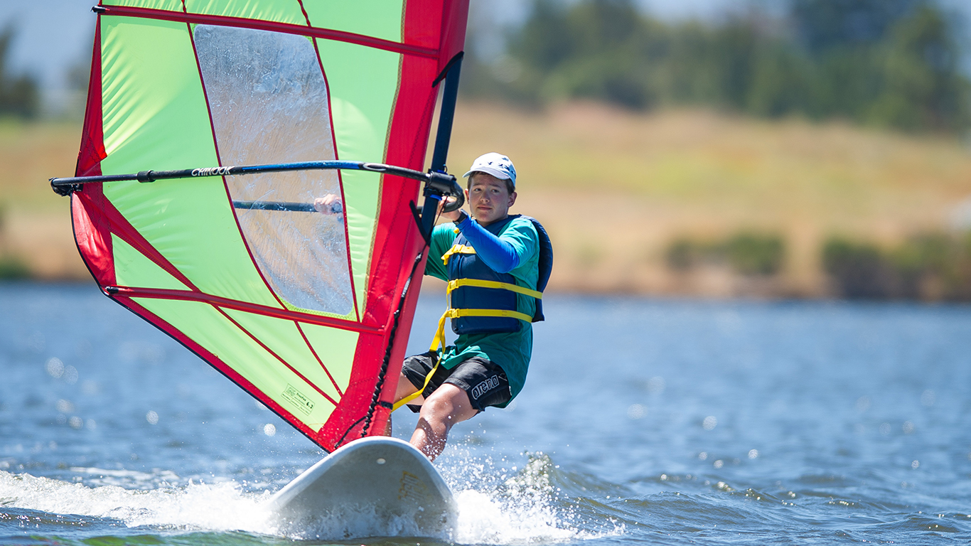 A boy windsurfing